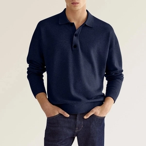 Detailed view of navy blue knitted polo shirt featuring a classic collar and button placket