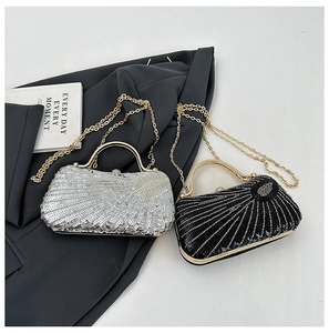Detail of sequin evening bags in silver and black with gold chains and metal frames