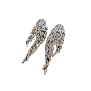 Elegant silver wing earrings with snowflake zircon pavé design for sophisticated style