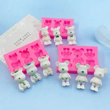 Detail view of 6-cavity pink silicone bear molds with white DIY resin and plaster crafts