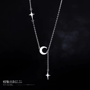 Detailed view of silver crescent moon and star tassel necklace with 40 plus 5cm chain