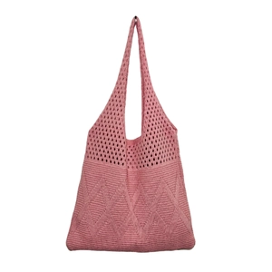 Detail view of pink knitted tote bag showing hollow diamond pattern and solid knit texture