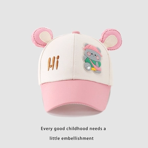 Detail of pink and beige kids baseball cap with plush bear patch and 3D ears