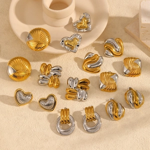 Two-tone 18k stainless steel earrings with textured heart and geometric patterns
