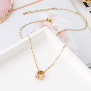 Rose gold double ring necklace in stainless steel with sparkling pave crystal pendants
