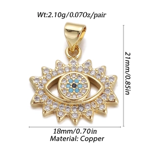 Detailed view of gold plated copper evil eye sun pendant with cubic zirconia stones