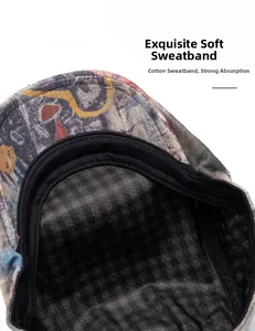 Detail of printed beret showing the breathable black mesh lining and cotton sweatband