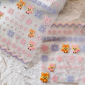 Miisha Nail pixel art stickers featuring cute foxes and colorful snowflakes on film