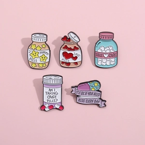Set of 5 medical theme enamel pins with creative pill and capsule bottle designs