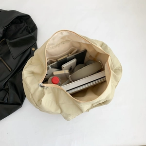 Puffy beige tote bag with large capacity showing laptop, books and daily essentials