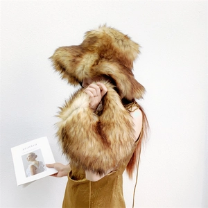 Detail of fluffy faux raccoon fur handbag and hat set with long plush punk Y2K aesthetic