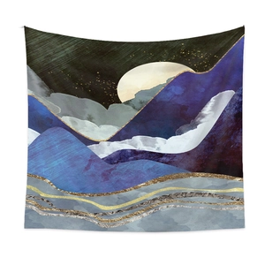 Detail showing the abstract mountain landscape and crescent moon on this decorative tapestry
