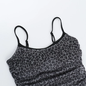 Detail of leopard print mesh camisole featuring adjustable straps and ruched neckline texture
