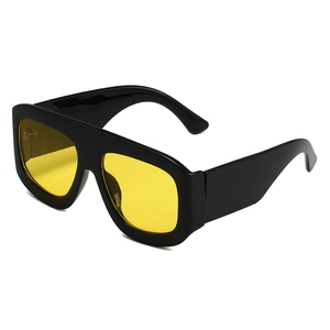 Classic large square black sunglasses with vibrant yellow lenses in a 45-degree angle view