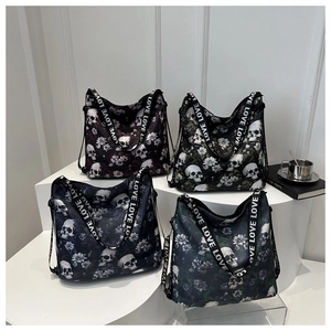 Detail of four gothic skull and floral print tote bags with LOVE letter straps