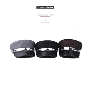 Flat top newsboy hats in gray, black and brown with leather brims and silver chain trim