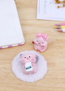 Cute pink pig resin figurines with rose and milk carton on wooden desk for car decor