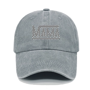 Detail of grey washed denim baseball cap featuring checkerboard MAMA letter print