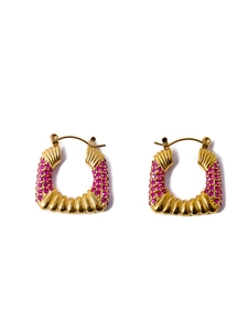 Detail view of gold C-shape earrings with wavy texture and micro-set pink zircon stones