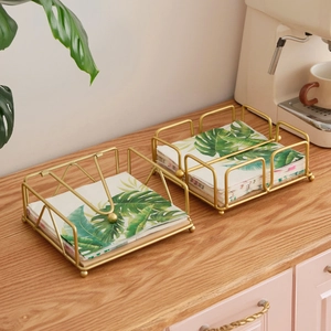 Golden iron napkin holder with weighted arm for restaurant table and home decor