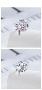 Detail of star and moon cartilage studs with pink and white cubic zirconia stones