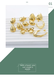 Macro shot of assorted 18K gold plated minimalist earrings and textured hoops on a white stand