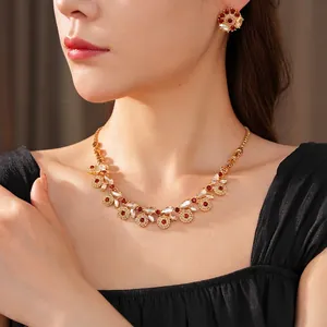 Vintage gold jewelry set with flower-shaped zircon necklace and matching earrings