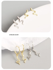 Detailed macro view of S925 sterling silver snake earrings in gold and silver finishes