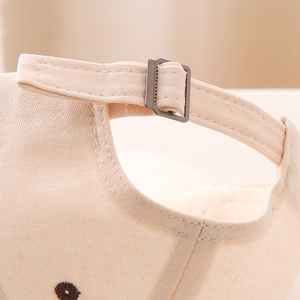 Adjustable beige cotton baseball cap with metal buckle closure detail for boys and girls
