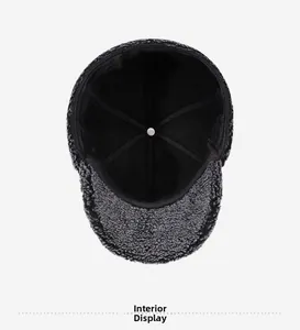 Interior view showing the black six-panel lining and durable crown button of the winter hat
