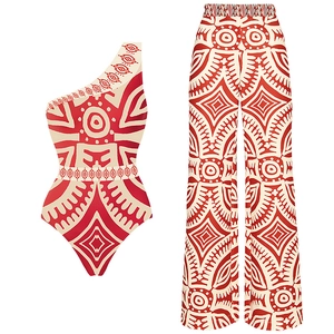 Detail of red ethnic print one-shoulder swimsuit set with high-waisted wide-leg pants