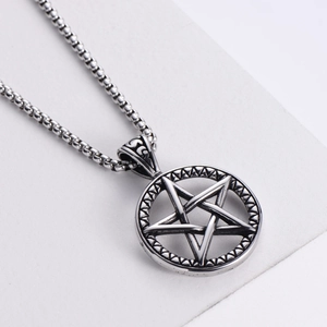 Retro punk star pendant necklace in vintage silver finish on minimalist white background