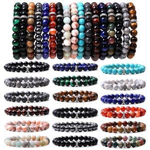 Tiger eye and matte black agate beaded bracelets set with natural stone accents