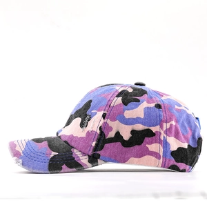 Side view of purple camo ponytail baseball hat with vintage distressed torn brim detail