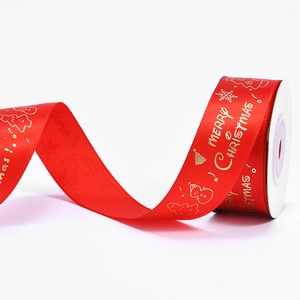 Red Christmas ribbon with gold foil Merry Christmas text and festive tree patterns