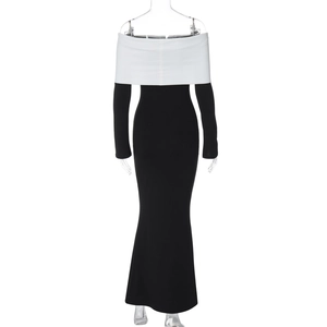 Detail of the off-shoulder black and white contrast design on a slim fit long dress