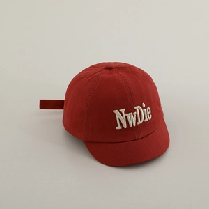 Detail of red toddler baseball cap with white 3D embroidery and adjustable strap