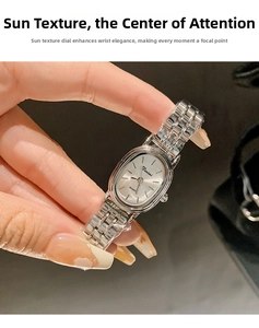 Close-up of Dinimi women's quartz watch with silver steel band on wrist in detail