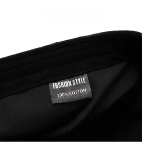 Detail of the internal 100% cotton wash label on the vintage black denim beret cap