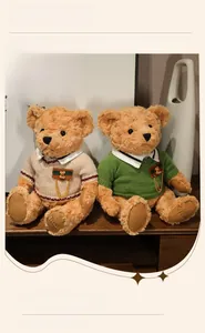 Detailed view of two teddy bears in knitted sweaters with badges and paw embroidery