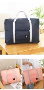 Foldable travel storage bag shown in navy and pink colors for organized luggage packing