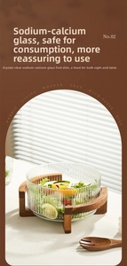 Detailed view of striped glass salad bowl with solid wood base and matching serving fork
