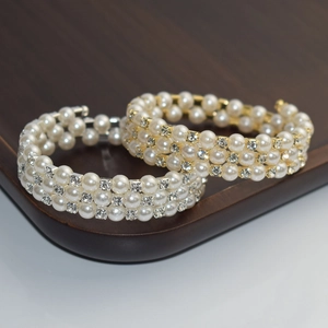 Detailed comparison of gold and silver triple-layer pearl and rhinestone coil bracelets