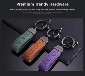 Detail of woven suede keychains in green, yellow, and violet with zinc alloy hardware