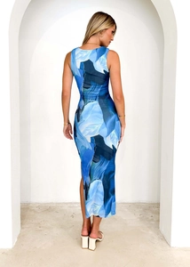 Rear view of a slim-fit sleeveless long dress featuring blue abstract digital prints