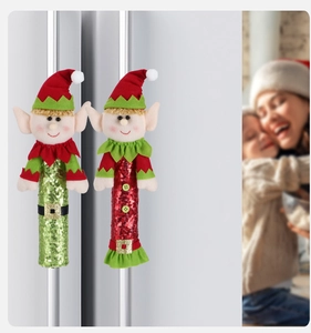 Detail view of festive red and green elf refrigerator handle covers with sequins