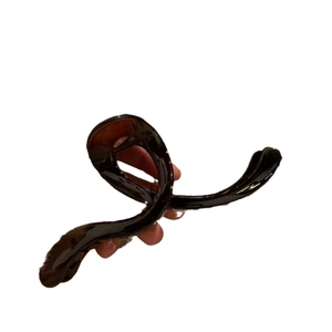 Large dark brown wave shark hair clip for elegant updo hairstyles on a white backdrop