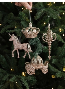 Rose gold glitter Christmas tree ornaments featuring unicorn and crown shapes on branches