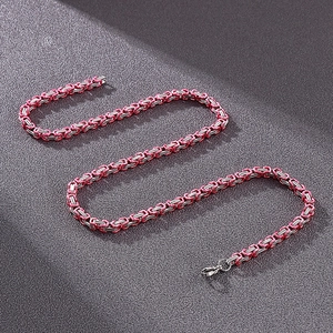 Close-up of pink and silver Byzantine chain with high-quality metal lobster clasp