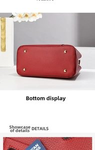 Macro shot of red pebble leather handbag base featuring four gold metal protective studs